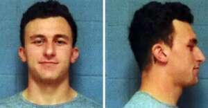 A mugshot of a young man with short dark hair, shown in two views: facing forward and in profile, against a plain blue-gray background. He is wearing a light gray shirt and has a neutral expression.