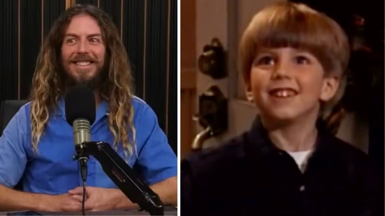 A man with long hair and a beard smiles in front of a microphone, while next to him, a young boy with a bowl haircut smiles indoors.