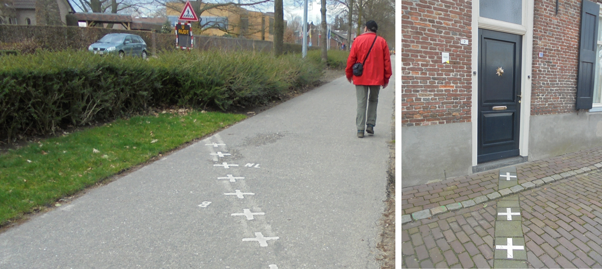 Borders. A man walks along a path with white crosses marking a border, while another section shows crosses extending up to a doorstep, dividing the entrance.