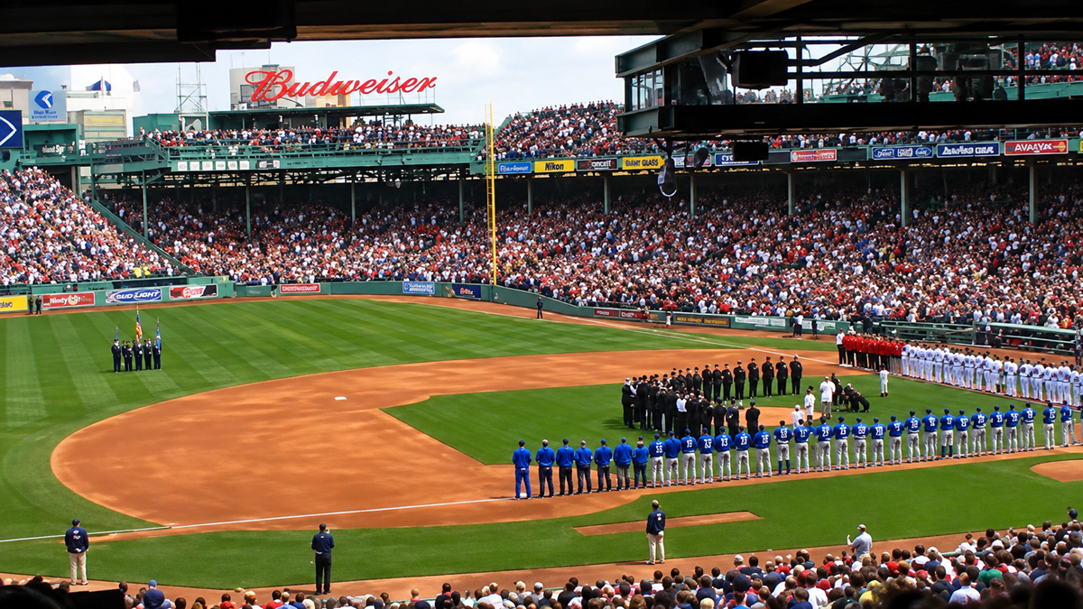 Baseball teams and officials line up on the field for a ceremony at a packed stadium, with spectators in the stands and a Budweiser sign visible in the background.