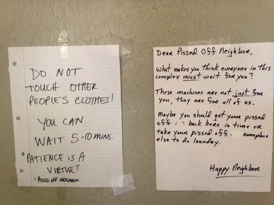 Two handwritten notes taped to a wall. One warns not to touch other people’s laundry, saying to wait 5–10 minutes. The other replies, frustrated, saying machines aren’t just for one person and to move clothes if they’re left too long.