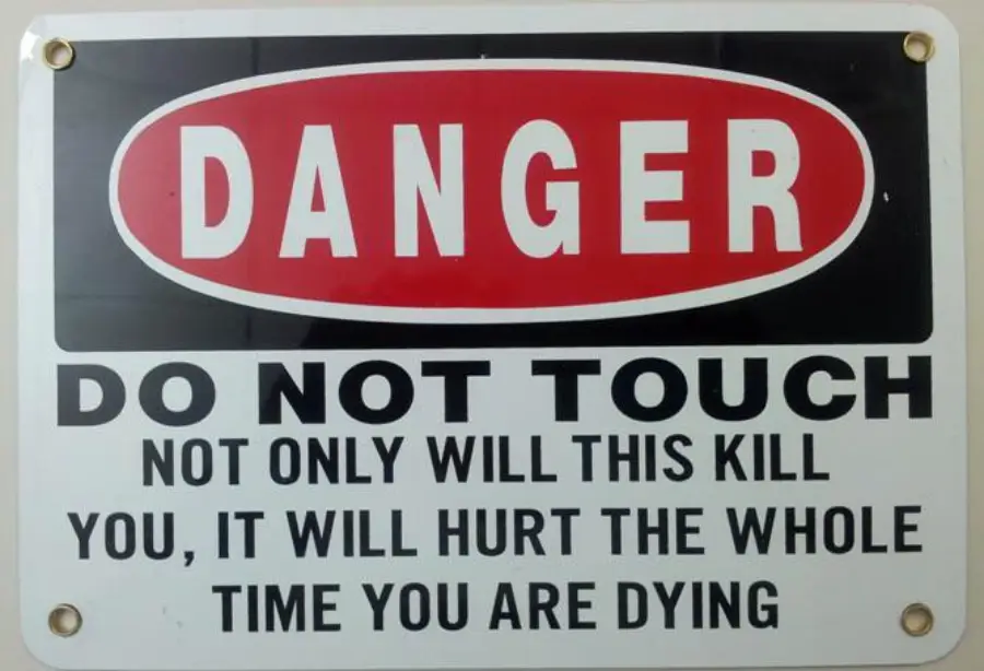 Warning sign reads: “DANGER DO NOT TOUCH. NOT ONLY WILL THIS KILL YOU, IT WILL HURT THE WHOLE TIME YOU ARE DYING.”