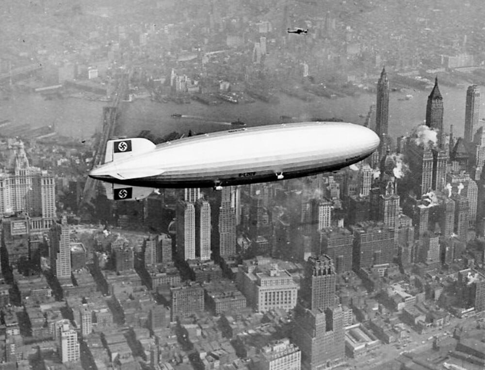 The Hindenburg airship flying over the Manhattan skyline.