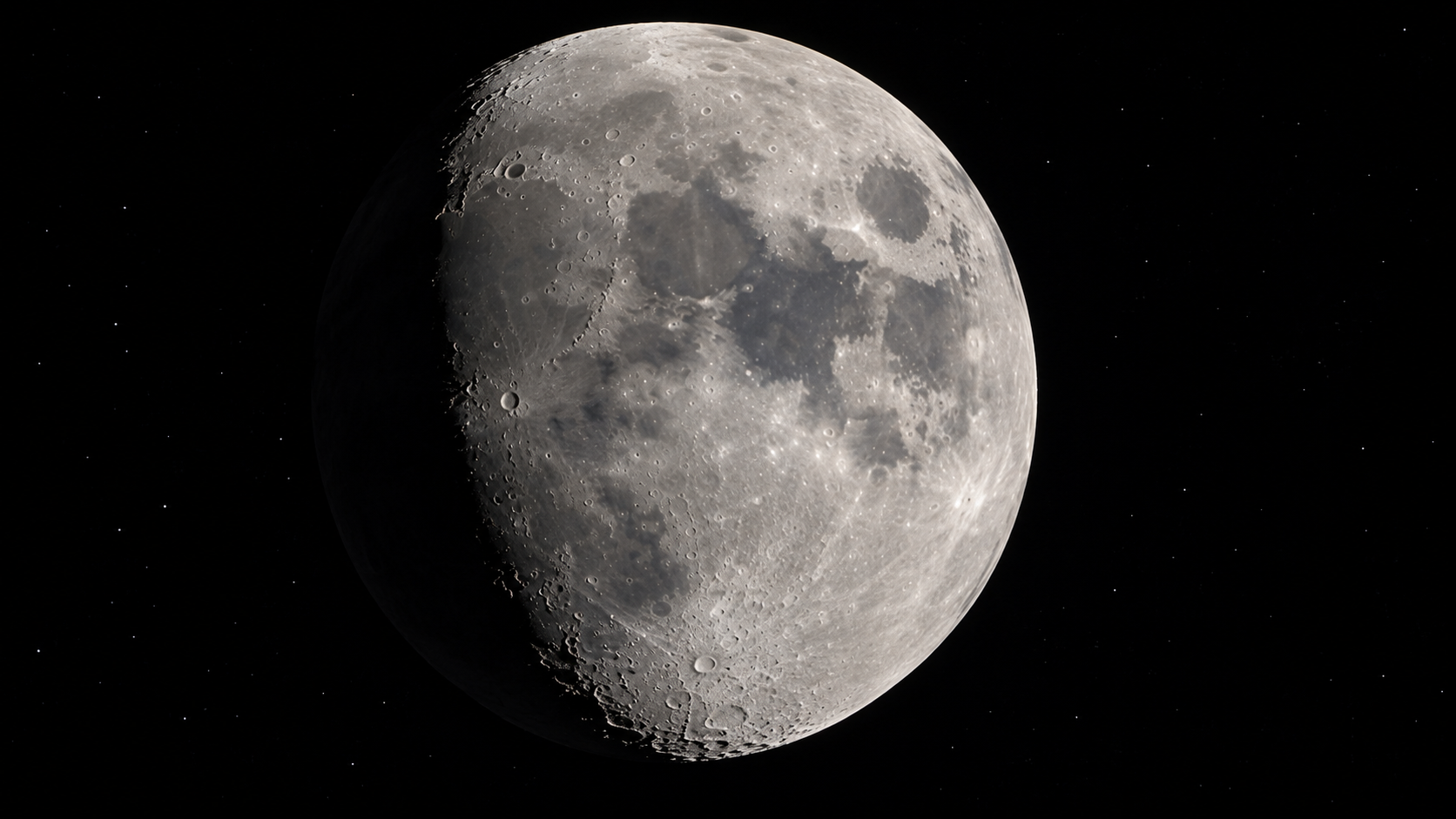 The moon in a waxing gibbous phase against a dark, starry sky.