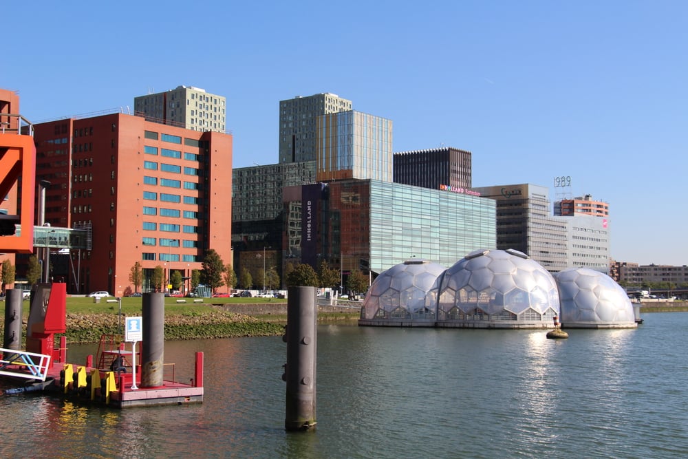 Rotterdam skyline featuring geometric dome structures along the waterfront.