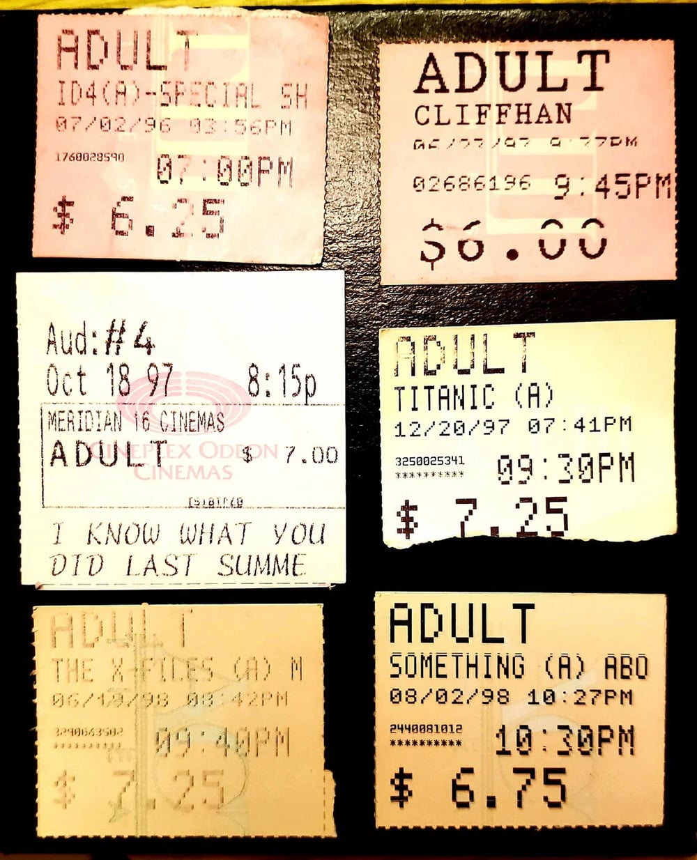 Six vintage movie theater tickets for adult admissions, including titles such as “Titanic” and “I Know What You Did Last Summer,” with dates ranging from 1996 to 1998.