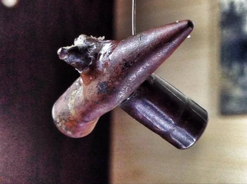 Two spent bullets fused together after impact.