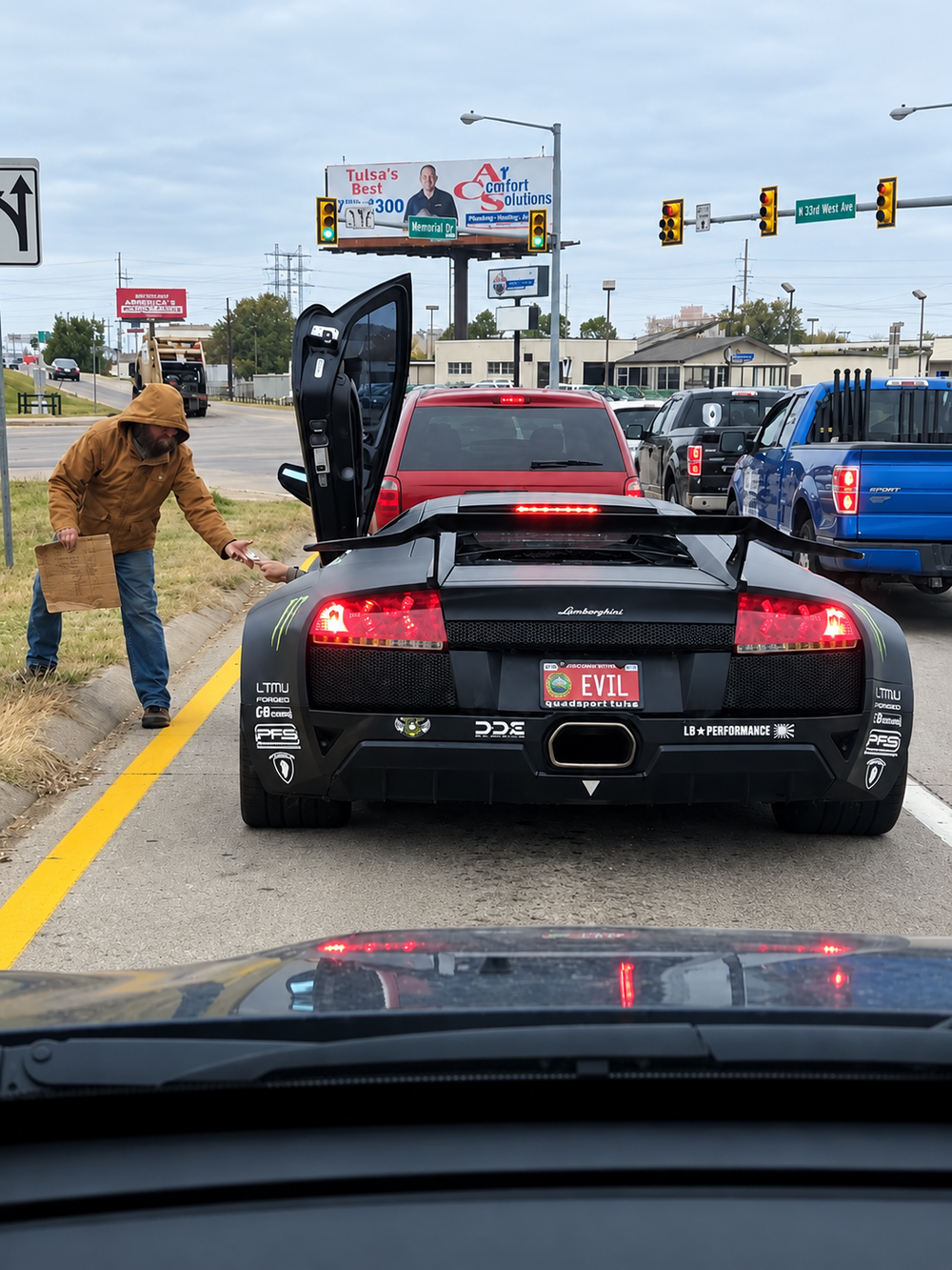 A person in a brown jacket stands on the side of the road, handing a small item through the open gull-wing door of a black Lamborghini with a license plate that reads “EVIL.”