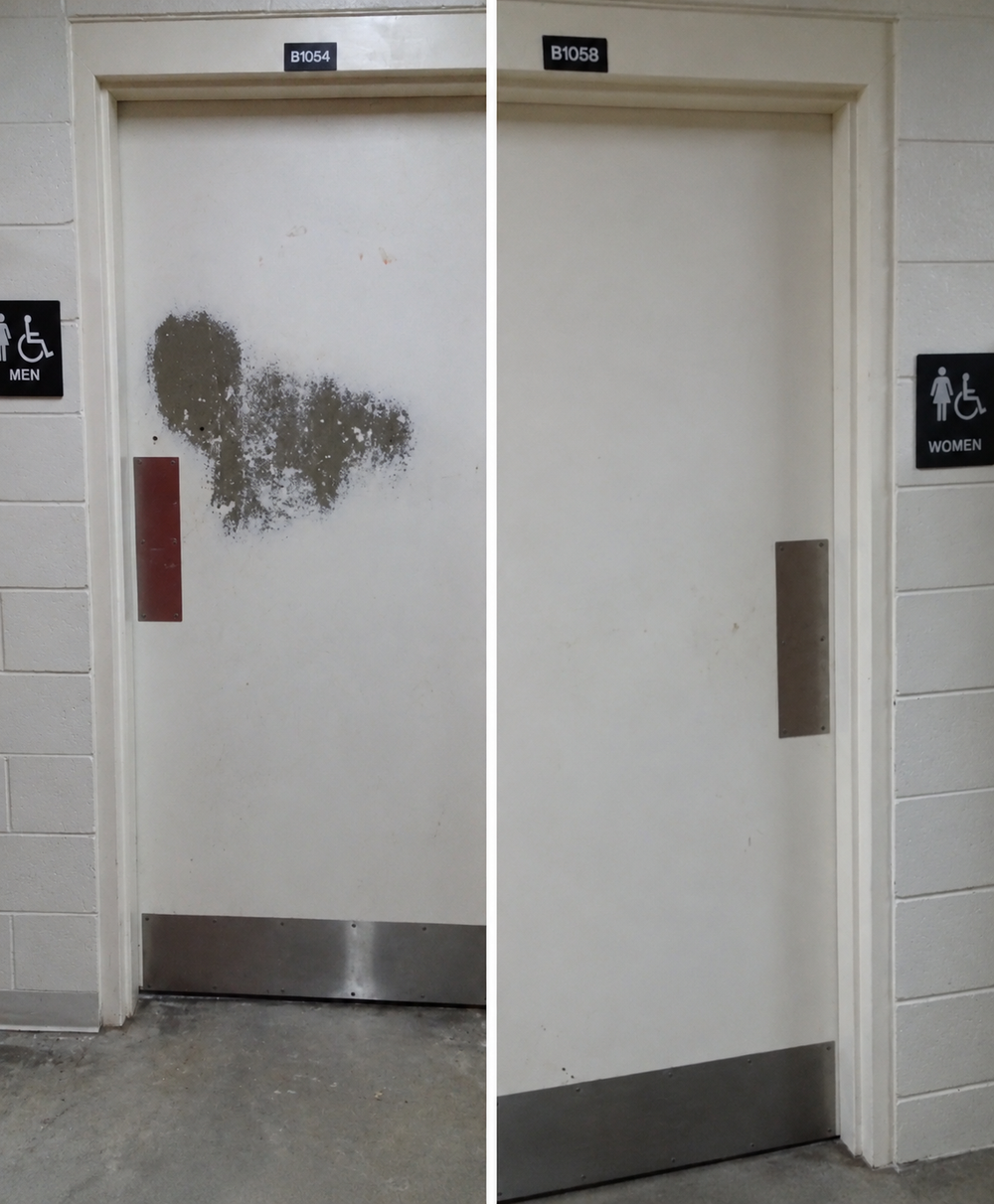 Two restroom doors with visible patches of wear around their push plates.