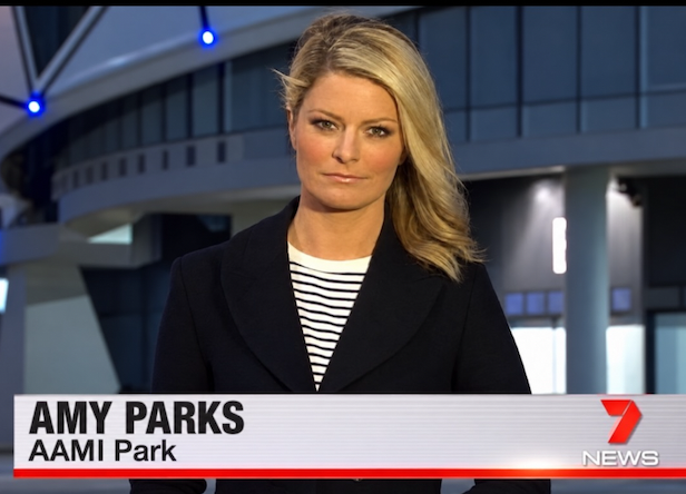 News reporter Amy Parks stands in front of AAMI Park, as shown on a Seven News broadcast graphic.
