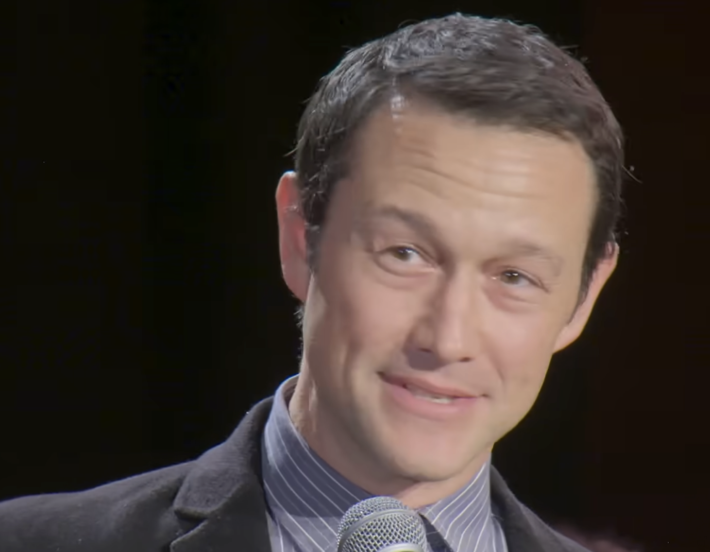 Joseph Gordon-Levitt speaking into a microphone.