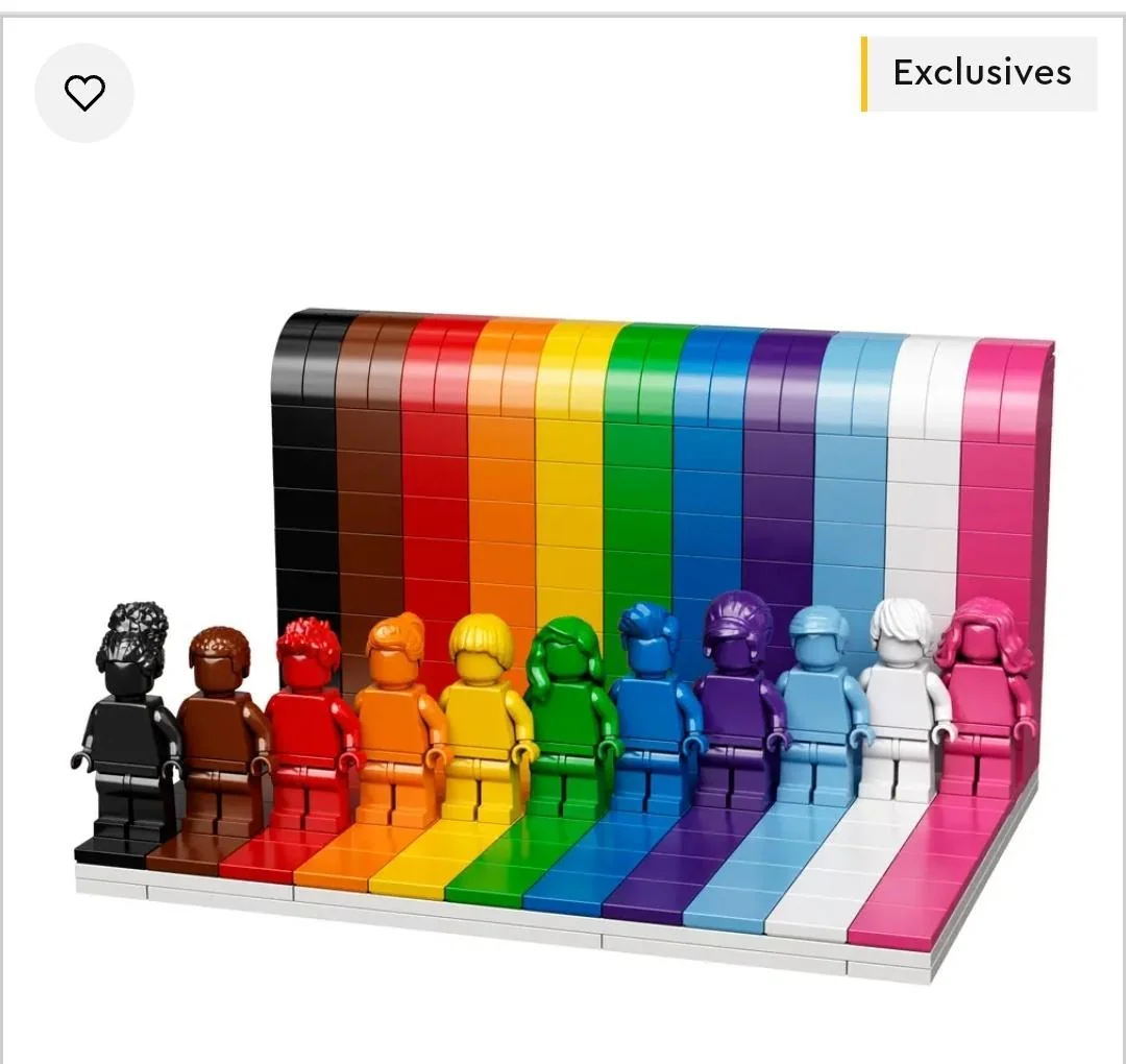 Eleven LEGO minifigures in a rainbow-colored gradient, each standing on a base plate matching their specific color against a matching vertical backdrop.