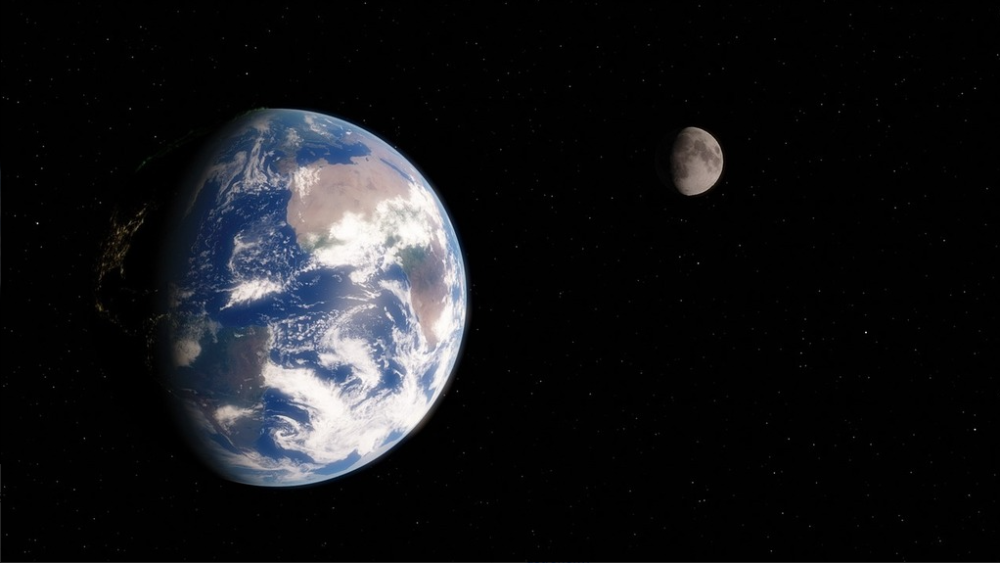 The Earth and Moon set against a backdrop of deep space.