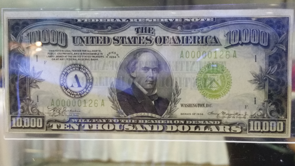 A 1934 ten-thousand-dollar Federal Reserve note featuring a portrait of Salmon P. Chase and the serial number A00000126A.