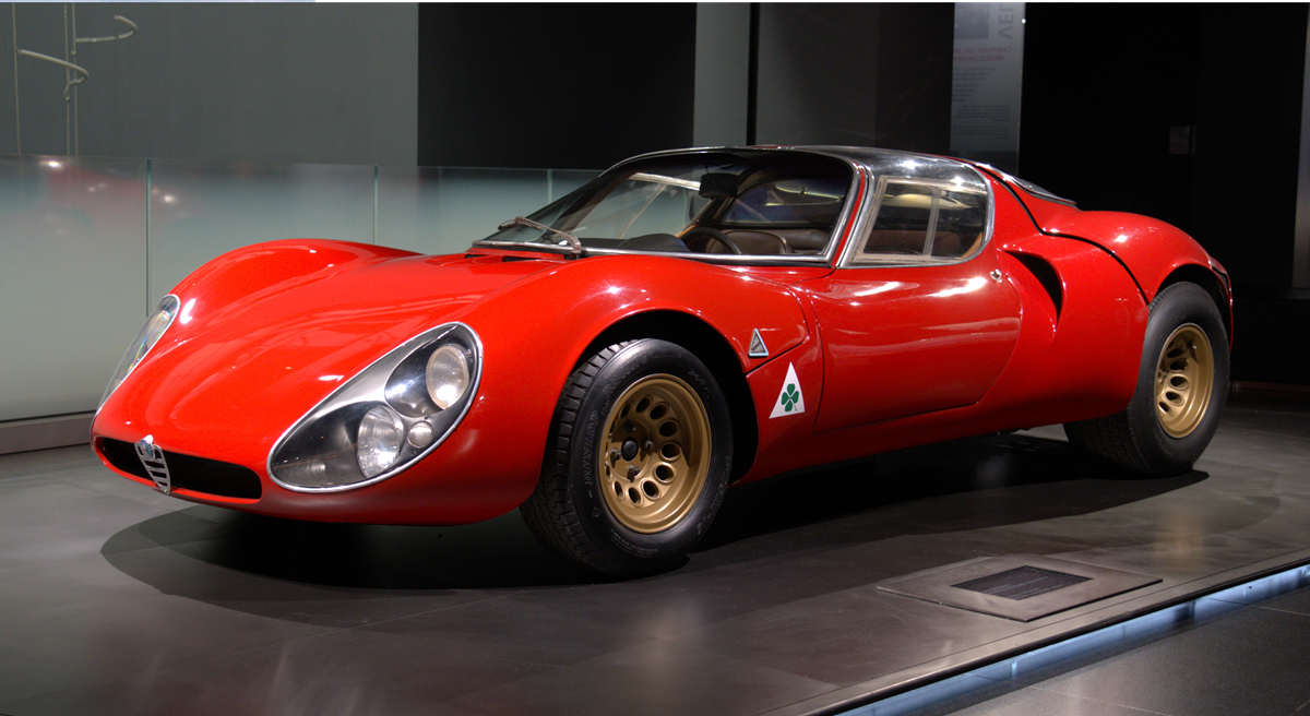 Classic cars, A red Alfa Romeo 33 Stradale sports car displayed on a museum platform.