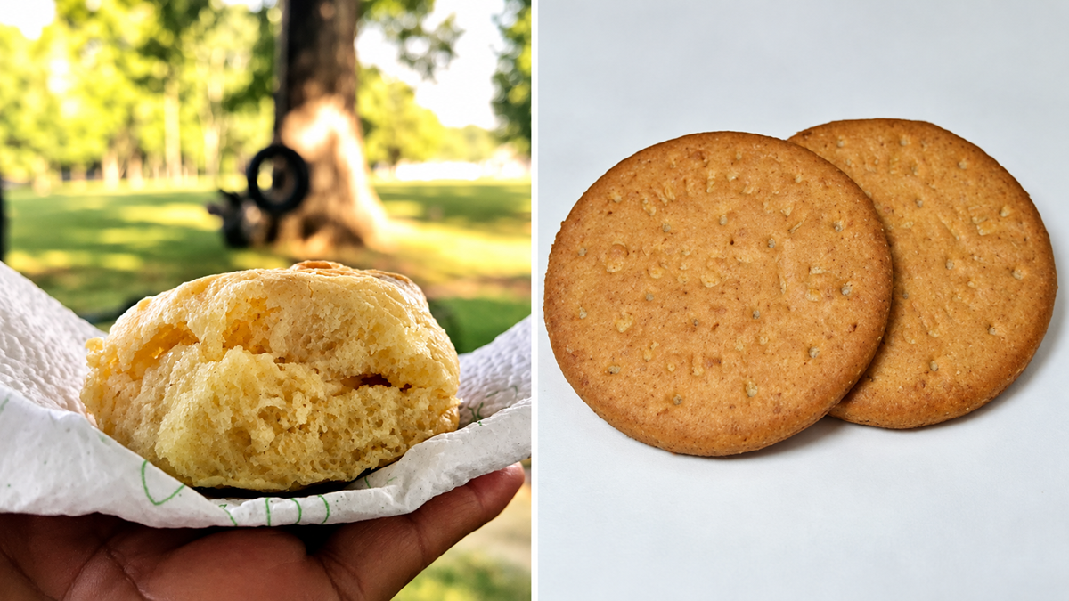 English words. A hand holds a scone on a napkin, next to two round, golden-brown biscuits.