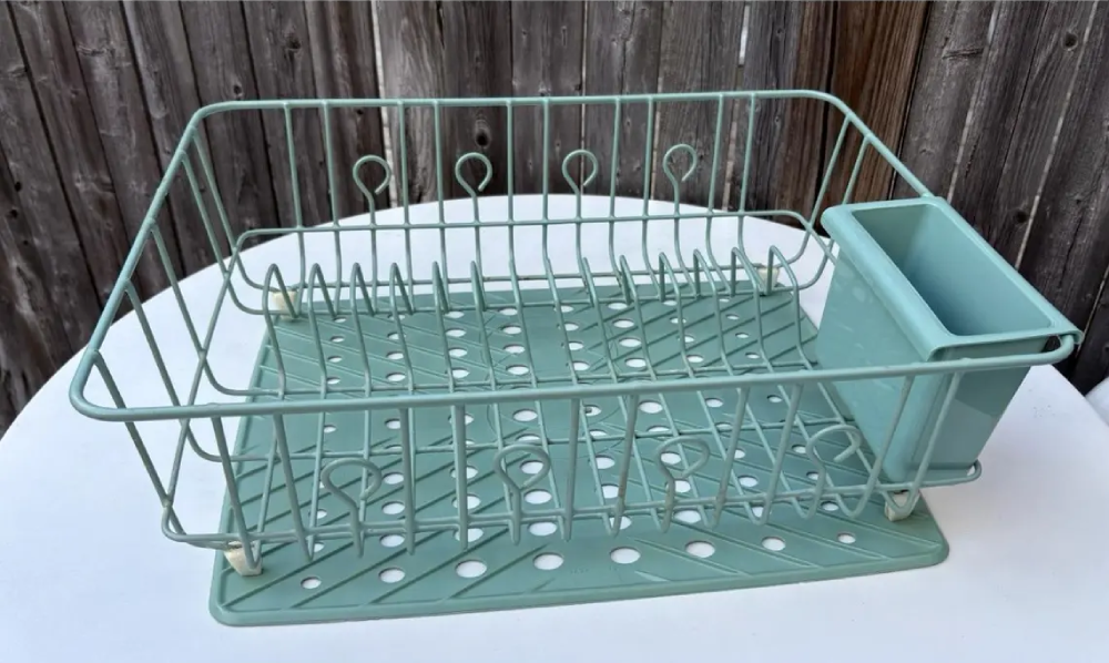 Light green wire dish drying rack with a matching plastic utensil holder.