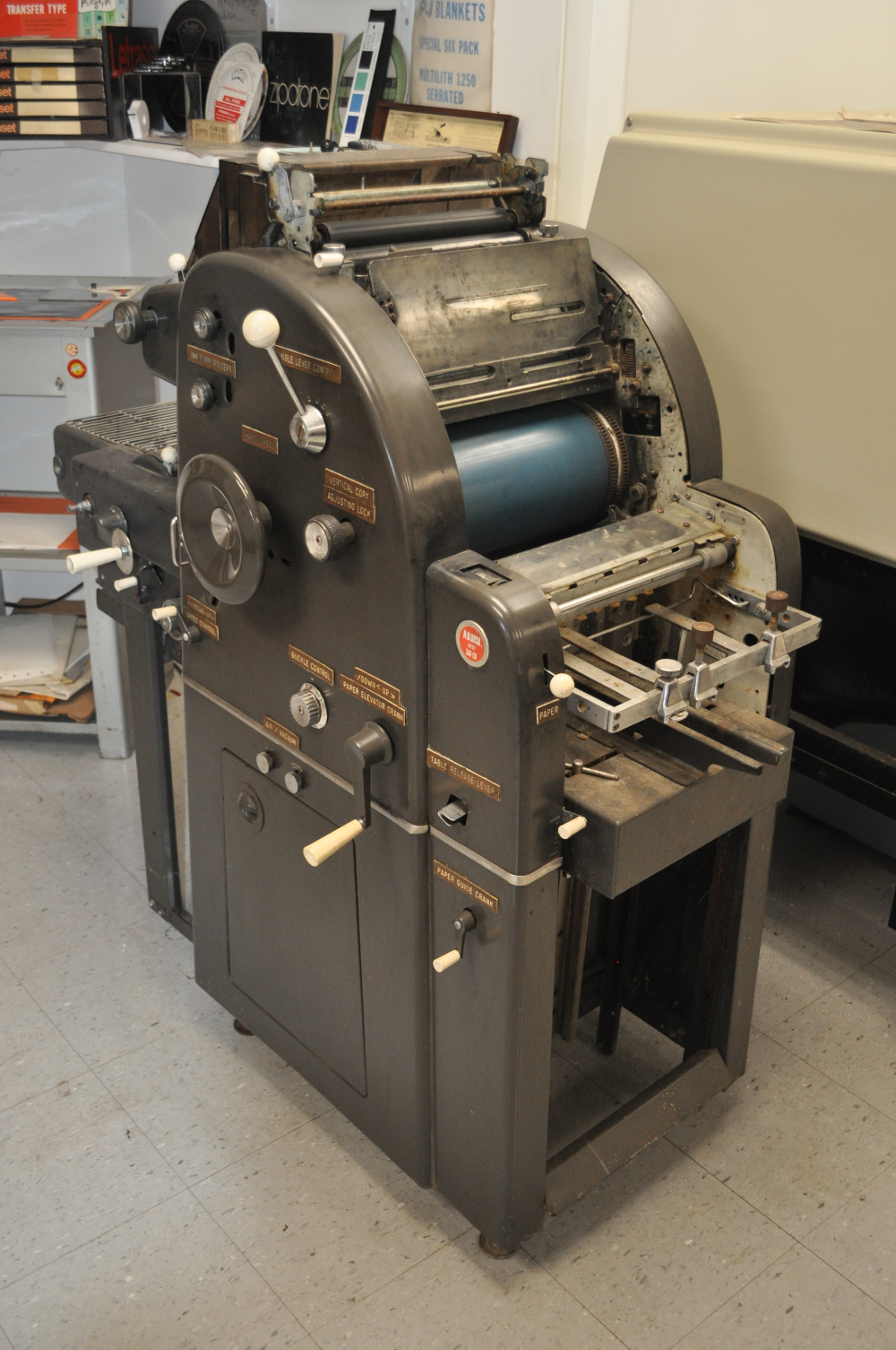 A Multilith 1250 offset printing press in a shop setting.