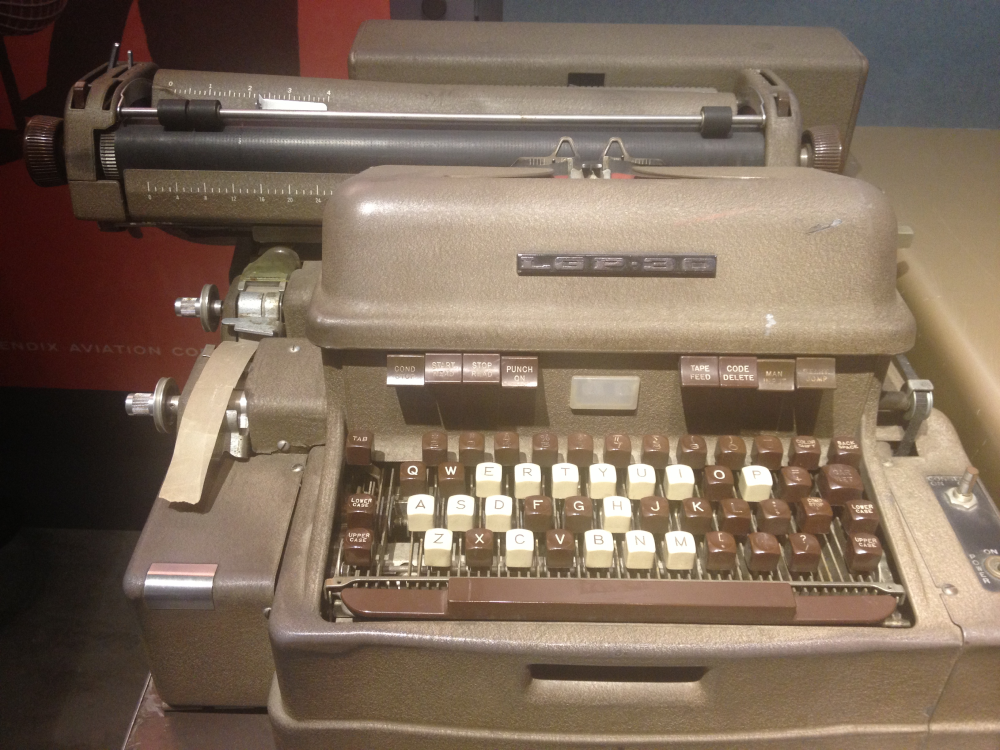 LGP-30 vintage computer with a typewriter-style keyboard and paper feed mechanism.