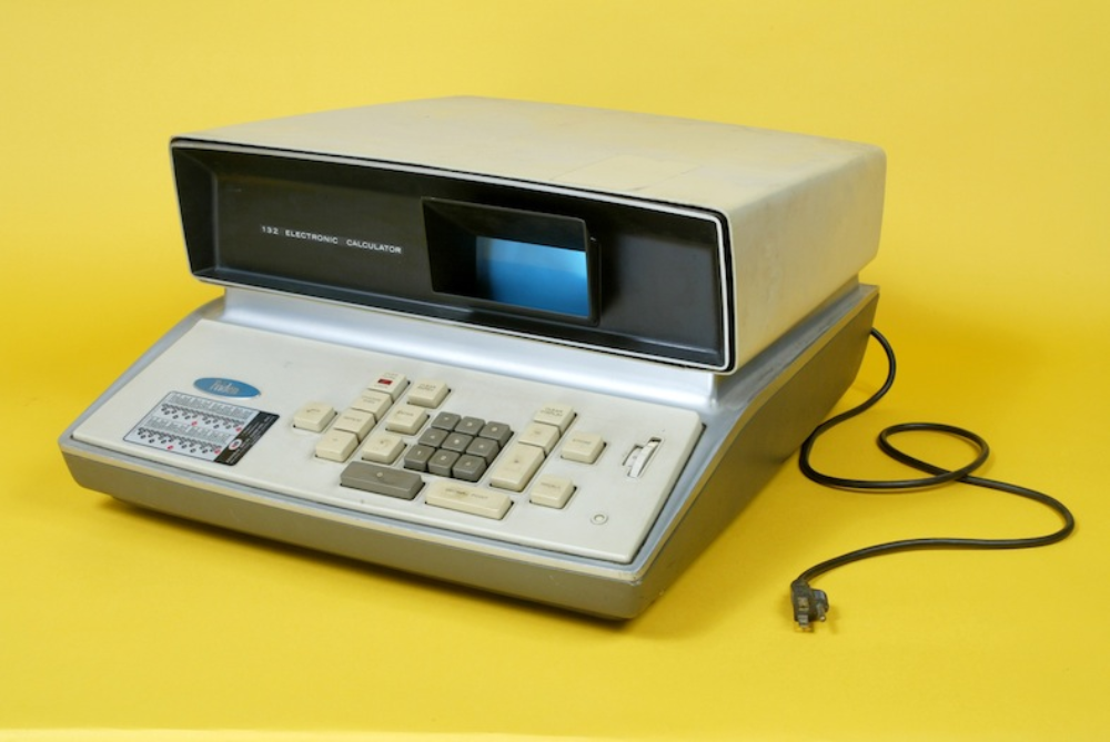 Vintage Friden 132 electronic calculator with a display screen and a numeric keypad.