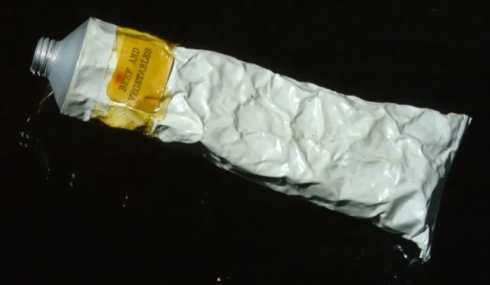 A crumpled metal tube labeled “Beef and Vegetables.”