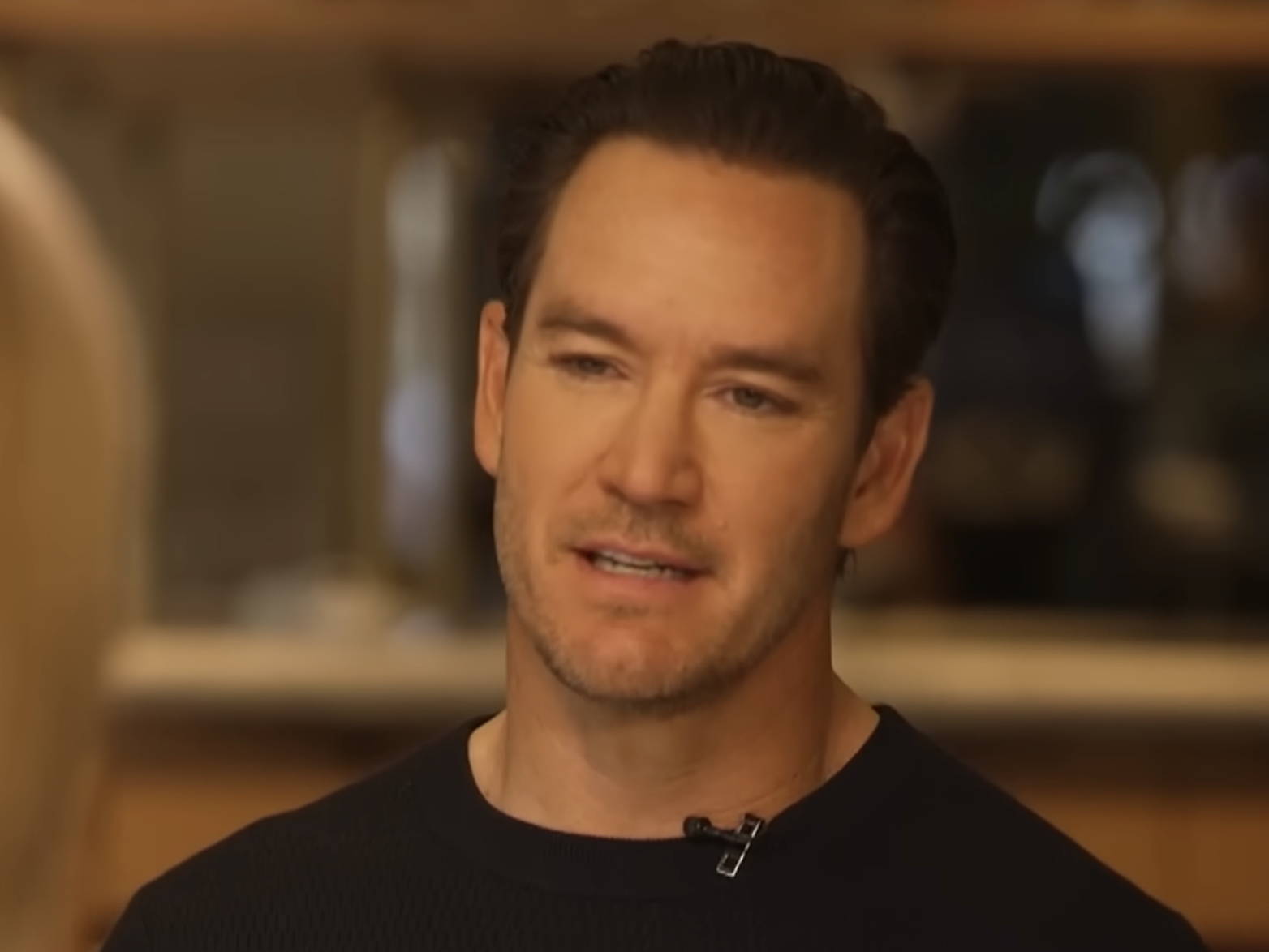 Mark-Paul Gosselaar speaking while looking off-camera.