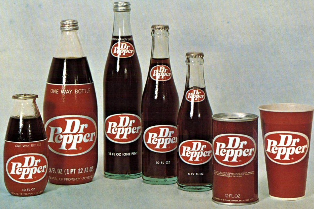 A selection of Dr Pepper packaging, including five glass bottles of varying sizes, one aluminum can, and one paper cup.