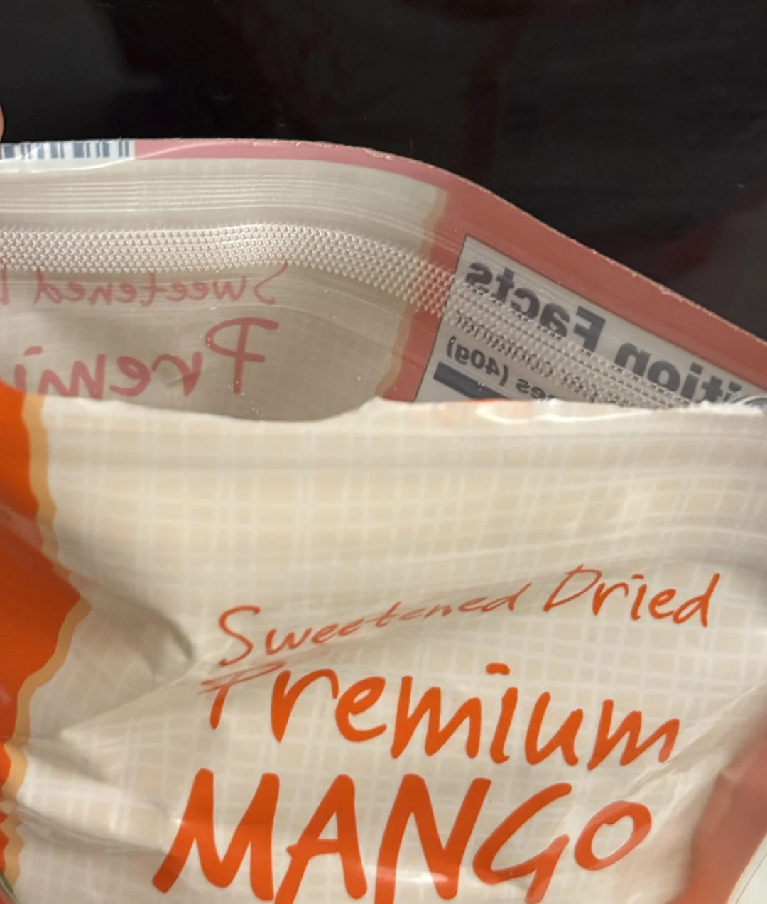 Open package of Premium Sweetened Dried Mango.