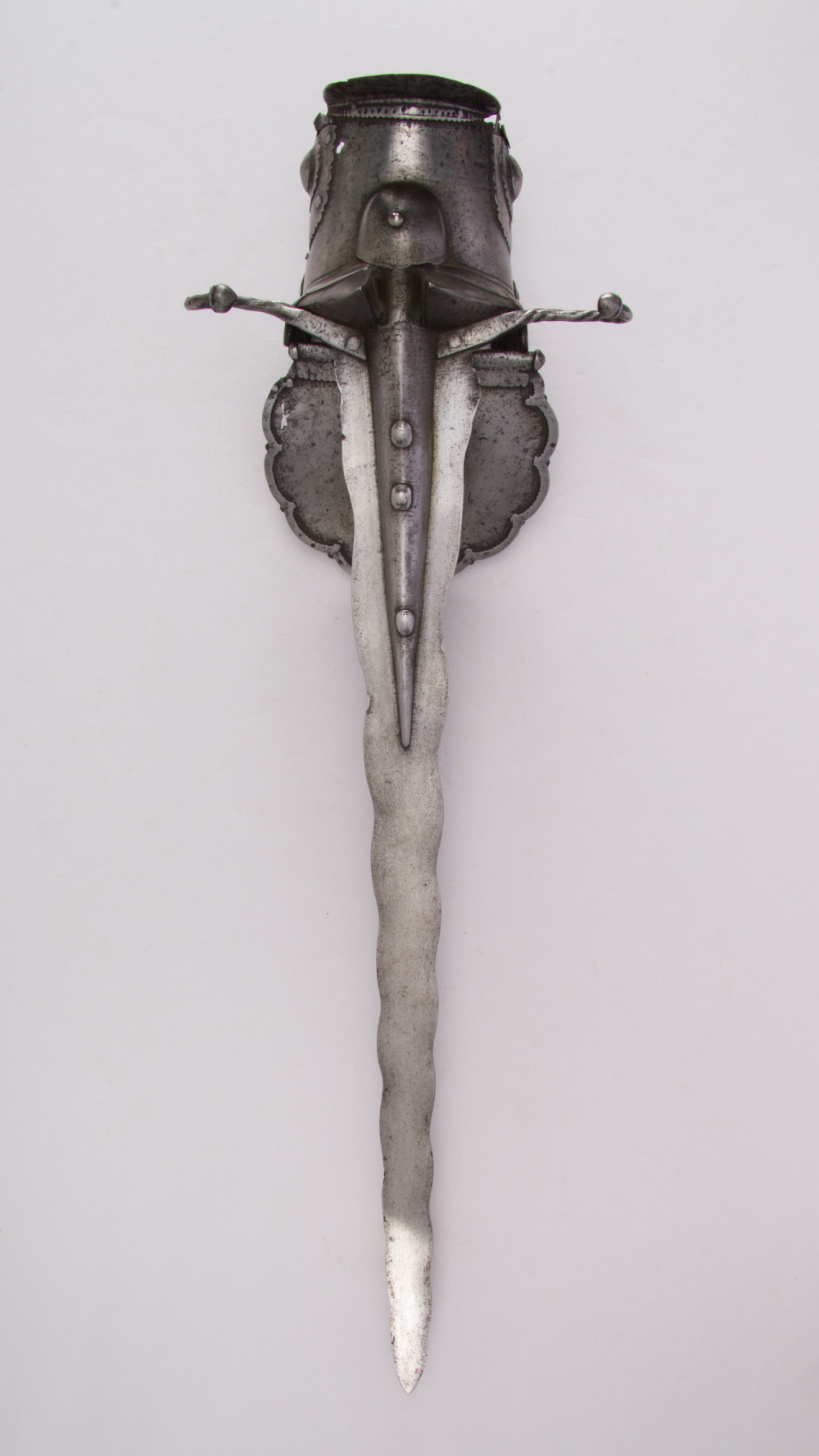 A main-gauche parrying dagger with a wavy blade and a wide, ornate hand guard.